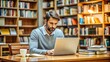 © Man888 - Busy adult male student sitting at desk, surrounded by open books and papers, intensely focused on laptop screen in quiet library atmosphere.
