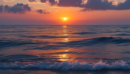 The beautiful sunset on the ocean, melodious waves and gorgeous clouds complement each other.