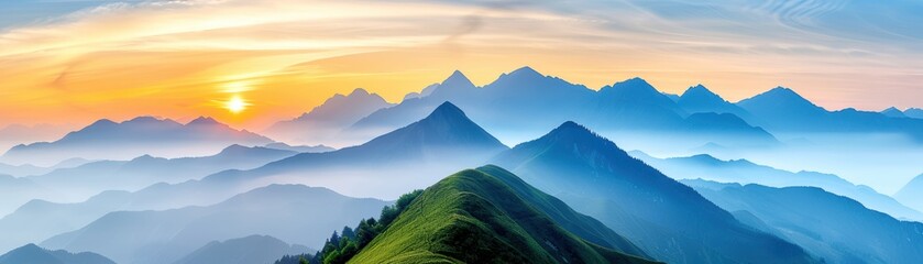 Wall Mural - A stunning panoramic view of a mountain range during sunrise, with layers of mist and a vibrant sky, capturing nature's serene beauty.