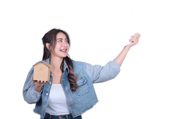 Wall Mural - A woman is holding a cardboard box and pointing at something