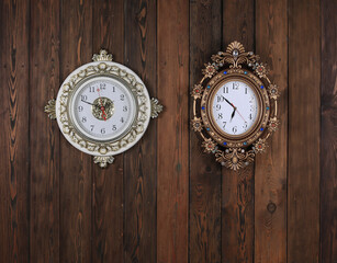 Poster - vintage wall ornamental clock on old wooden background