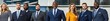 © BrandwayArt - Professional team poses confidently outside modern office building