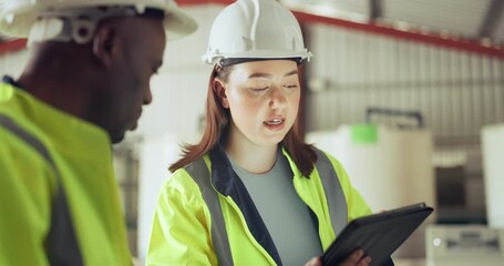 Canvas Print - Tablet, industry and a construction worker team talking in a warehouse for planning or discussion. Diversity, communication and engineer team together in a plant or factory for manufacturing safety