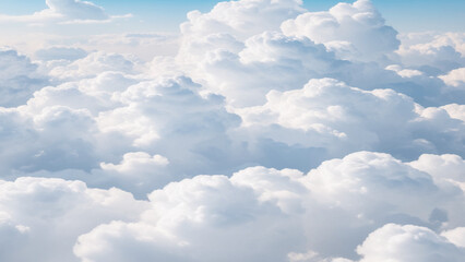 Wall Mural - White Clouds from above. Aerial view of the fluffy white cloud on blue sky. Top view from an airplane over white clouds in a blue sky. High in the Heavens.