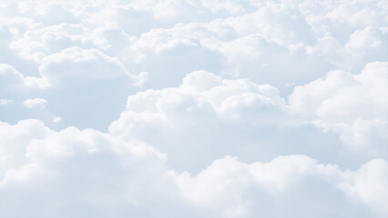 Wall Mural - White Clouds from above. Aerial view of the fluffy white cloud on blue sky. Top view from an airplane over white clouds in a blue sky. High in the Heavens.