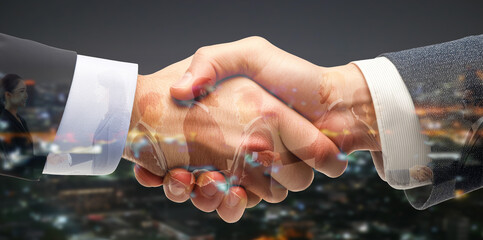 Businessperson making handshake for business, finance collaboration on a city background, teamwork, and successful business