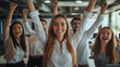 © zineb - A vibrant business team celebrates success with raised fists in a modern office setting. Their expressions show excitement and accomplishment, representing teamwork and professional achievement.