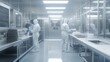© Darya - Laboratory specialists in cleanroom attire work on pharmaceutical processes within a sterile environment focused on research and manufacturing