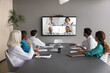 © fizkes - Virtual meeting event of diverse medical internists professionals, communicate remotely using videoconference application, gathered together in boardroom of clinic. Opinion, exchange, decision-making