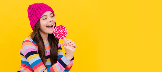 Sticker - yummy. happy teen girl singer hold lollipop. lollipop lady. hipster kid with colorful lollypop. Teenager child with sweets, poster banner header, copy space.