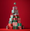 © Miss V - christmas tree made of stacked gift boxes on red background. Season greetings concept