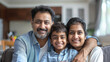 © Julia Zarubina - happy Indian family sitting on the sofa in a modern apartment, father, mother, son, child, husband, wife, portrait, smiling people, lifestyle, man, woman, boy, kid, parents, children, India, home