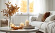 © TheoTheWizard - Scandinavian living room with white walls, wooden accents, autumn leaves in a vase and candles on the coffee table
