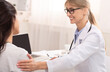 © Prostock-studio - Visiting Physician. Smiling Doctor Woman Comforting Female Patient During Medical Appointment In Her Office. Selective Focus