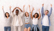 © Prostock-studio - Lifeful young international friends putting hands up, showing diverse gestures, panorama