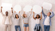 © Prostock-studio - Smiling international group of teenagers looking at empty speech bubbles above over white brick wall