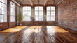 © Tanuha - a spacious, empty studio with a wooden floor, a brick wall, and large windows that flood the room with natural light, perfect for dance or creative activities.