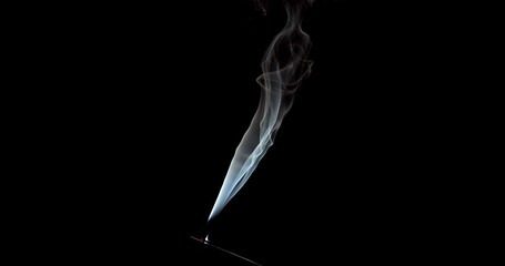 Wall Mural - Real smoke on a black background. Thin Flexible Trickle of Real Smoke. Colorful real smoke rises up. Ideal for background or over-layer with blending mode add, screen, lighten.