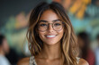 © NE97 - A beautiful hispanic woman wearing glasses smiles confidently in a trendy casual style.