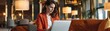 © ZeNDaY - Professional Businesswoman Working on Laptop in Stylish Hotel Lounge