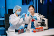 © Nuttapong punna - Young scientists conducting research investigations in a medical laboratory, a researcher in the foreground