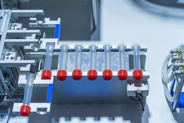 Wall Mural - robot arm with test tube for biological experiments in laboratory