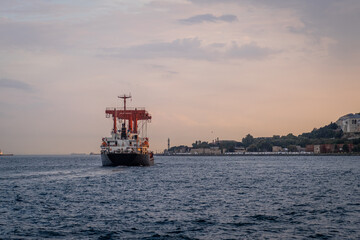Poster - Freight ship sails along the Bosphorus off Istanbul's coast, capturing 