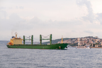 Poster - Freighter ship sailing along the Bosphorus with Istanbul's iconic skyline 