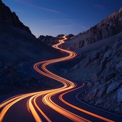 High angle view of light trails on road through mountains at night,