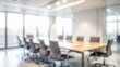 © Mari - Blurry Team Collaboration Room - Gentle blur of a team collaboration room with blurred office elements.