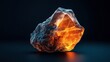 © Natalia - A glowing orange crystal rock against a dark background, emitting light from within and casting shadows on the surface.