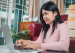 © Thawatchai Images - Businesswomen working business SME online at home her checking order from laptop for customer and online delivery for ready packing, Checking orders from customers with digital laptop, Small business.