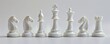 © Coosh448 - White chess pieces on white background, 4K hyperrealistic photo