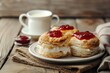 © LimeSky - Close up horizontal image of scones jam and tea with milk on the table