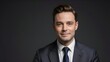 © Royal studio - professional man in a dark suit with a confident expression, isolated against a plain background, perfect for corporate, business or formal themes