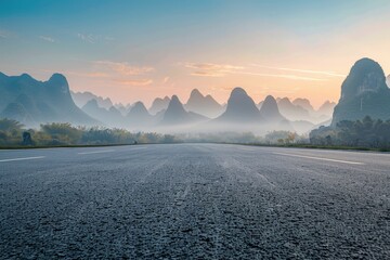 Wall Mural - A serene mountain scene featuring a winding road amidst towering peaks