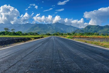 Scenic mountain views over asphalt road under blue sky