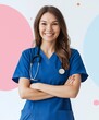 © kinara art design - Smiling female doctor with crossed arms wearing blue scrubs and stethoscope.
