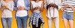 © Prostock-studio - Cropped of multiracial group of teenagers uisng mobile phones over yellow background, social media addiction concept, panorama