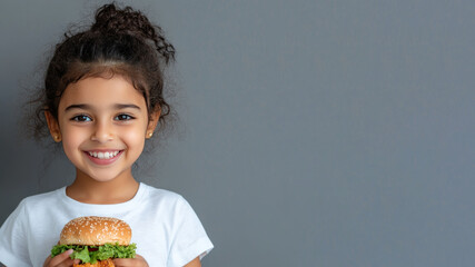 Arabian little girl smile holding hamburger fast food for student lunch