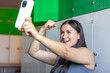 © puhimec - Sports pregnant woman makes selfies after workout at the gym.