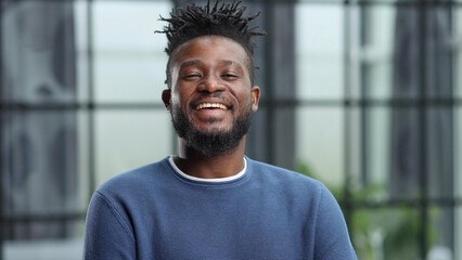 Confident black business man looking at camera with serious expression