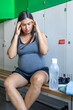 © puhimec - Tired pregnant woman after sports exercise. aAsporting active lifestyle.