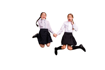 Wall Mural - Full length body size view of two person nice attractive charming cheerful cheery amazed astonished pre-teen girls having fun holding hands isolated over bright vivid shine orange background