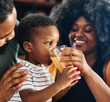 © Lumos sp - child family kitchen boy son mother father drink breakfast juice healthy fruit food drinking thirsty eating glass home black african american childhood cute love bonding