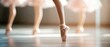 © Purichaya - Graceful ballet dancers performing in soft lighting, showcasing their elegant movements and artistry in a serene studio environment.