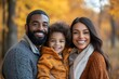 © James - Cute mixed race family portrait outdoors. Walking together in nature with the fall colors in the background. A candid photo of Smiling, happy, diverse, Generative AI