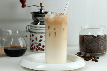 Wall Mural - Iced Coffee Latte in a Tall Glass with Milk