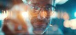 © Arrseman - Focused middle-aged man working in futuristic environment, illuminated by vibrant neon lights, reflecting concentration and innovation.