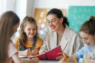 Wall Mural - Happy kids and teacher at school